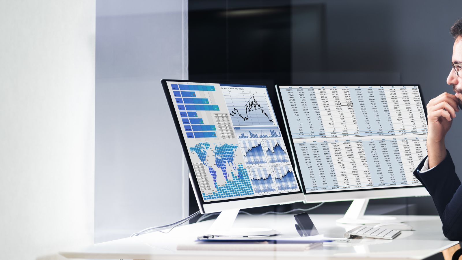 A photograph of a man looking at a dashboard that has premium data visualisation and powerful analytics.